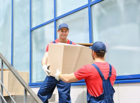 Professional removals team loading household items in Colliers Wood