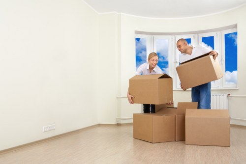 A removals team loading furniture for a home move in South West London