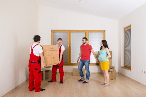 Removal specialists handling apartment access and transport in Colliers Wood