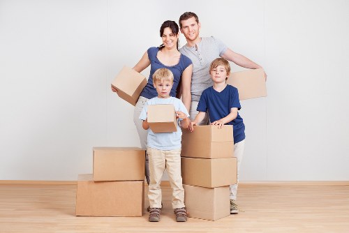 Man and van moving boxes and furniture in Colliers Wood