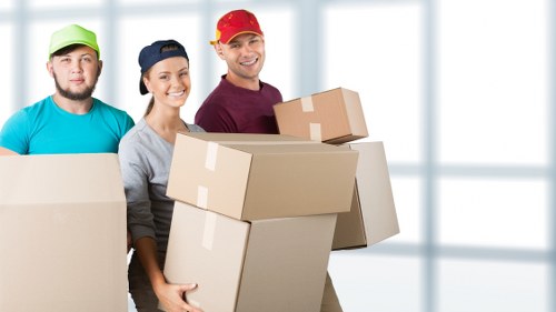 Packed boxes and furniture ready for a house move in Colliers Wood