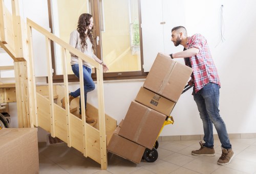 Local team removing sofas, beds, and wardrobes from a Colliers Wood property