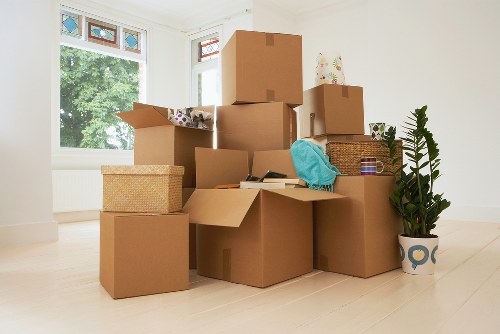 House moving service handling furniture in a Colliers Wood apartment building