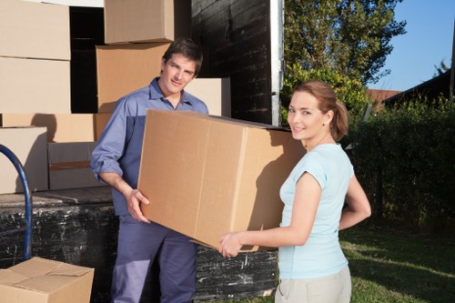 Furniture and household items being transported by a removal van