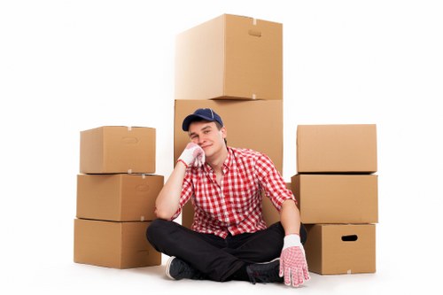 Packed boxes and furniture ready for a local move in Colliers Wood